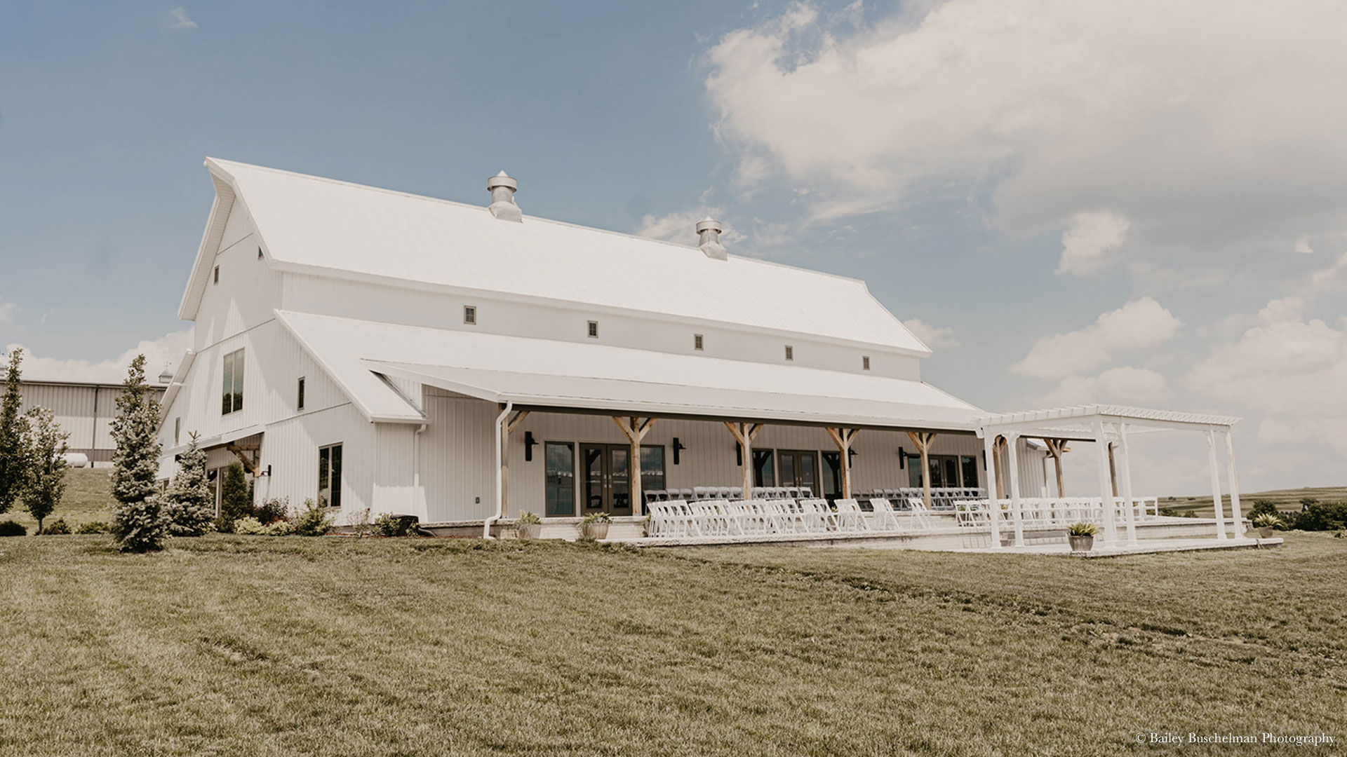 palace-events-center-bailey-buschelman-photography-outdoor-ceremony-wide Exterior view of outdoor wedding ceremony setup at Palace Event Center