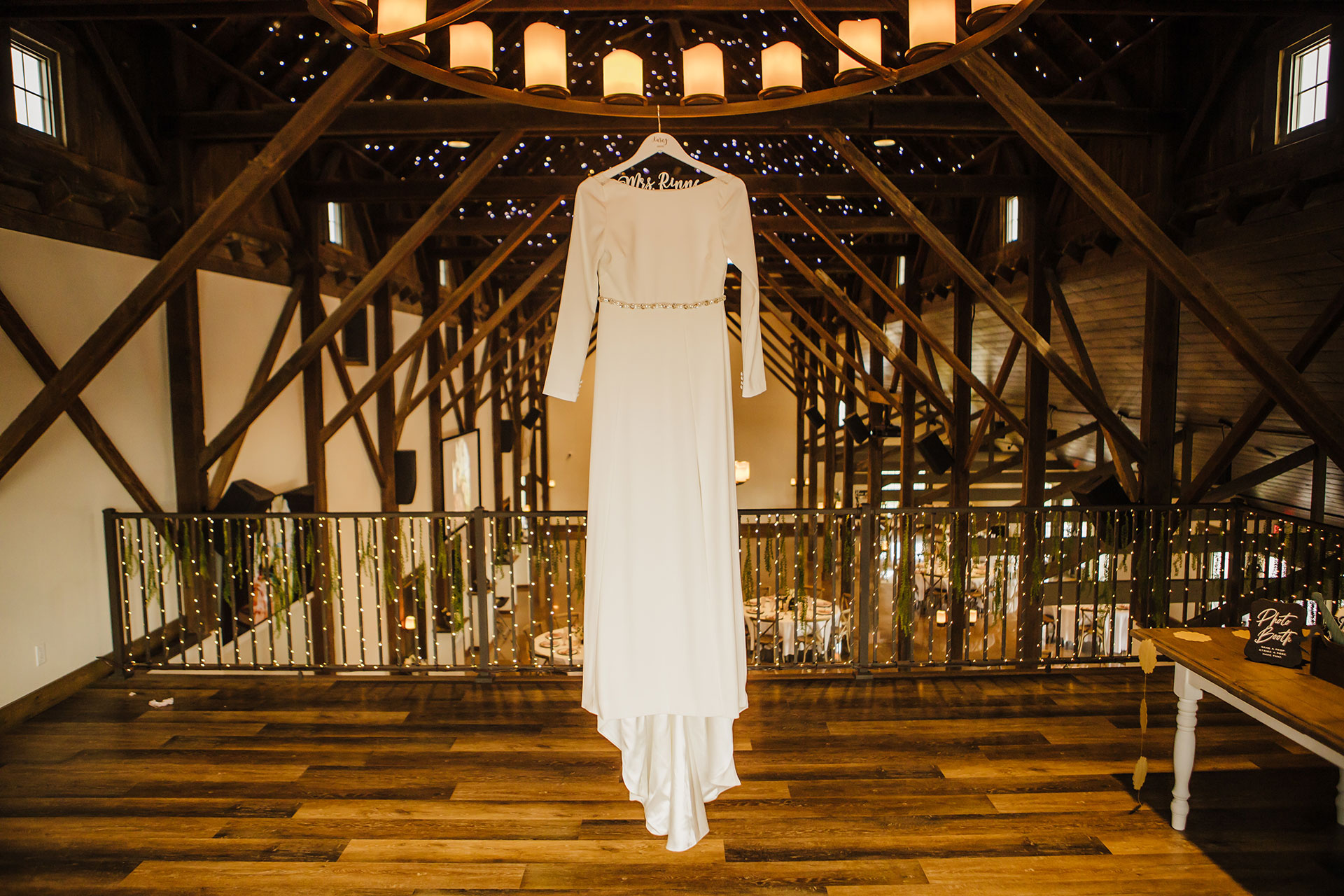 palace-event-center-heart-of-hoye-wedding-dress-loft Bride showing wedding train in barn loft | Emma Christine Creative