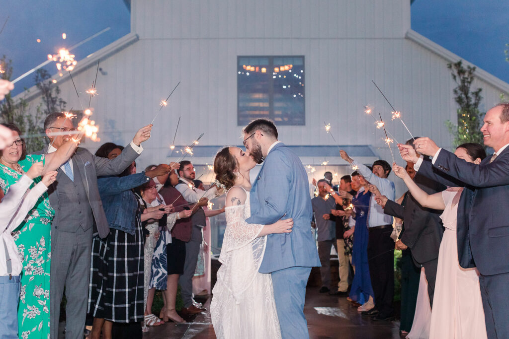 Bride and groom walking through sprinklers | Emma Christine Creative